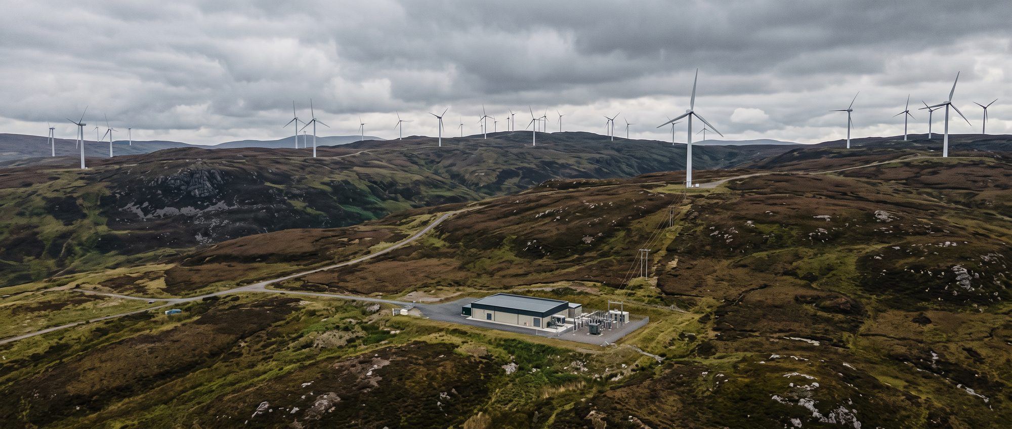 An onshore wind farm on Scottish moorland with a co-located industrial building connected by private wire